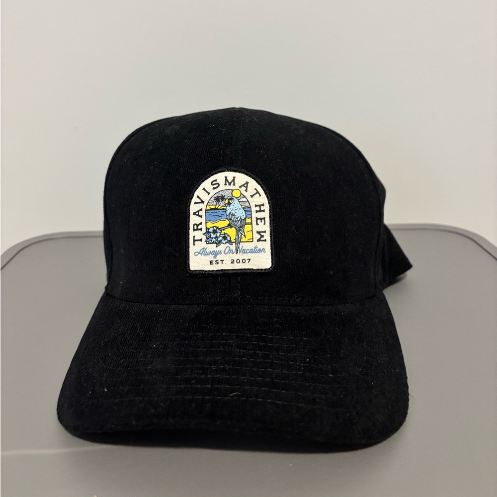 TravisMathew Black Cap with Multicolor Patch